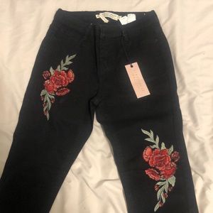 Black Skinny High rise jeans with roses on front